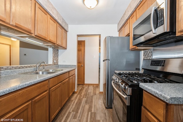 7914 164th Ct Unit 0, Tinley Park, IL 60477 - kitchen featuring appliances with stainless steel finishes, light wood-style flooring, and brown cabinets