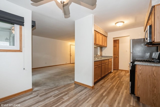 7914 164th Ct Unit 0, Tinley Park, IL 60477 - kitchen with appliances with stainless steel finishes, light wood finished floors, brown cabinetry, and a ceiling fan