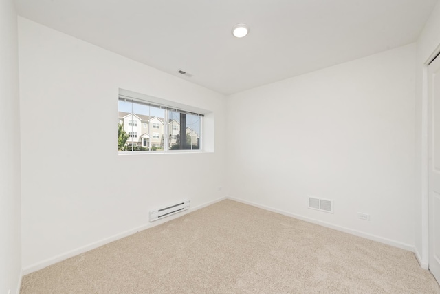 170 Goldenrod Dr, Elgin, IL 60124 - spare room with a baseboard heating unit and carpet