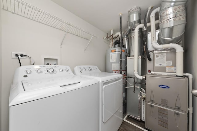 170 Goldenrod Dr, Elgin, IL 60124 - laundry room with washer and dryer, heating unit, and wood finished floors