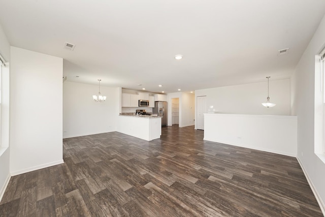 170 Goldenrod Dr, Elgin, IL 60124 - unfurnished living room with dark wood-style floors, a chandelier, and recessed lighting