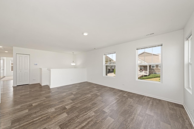 170 Goldenrod Dr, Elgin, IL 60124 - empty room with dark wood finished floors and recessed lighting