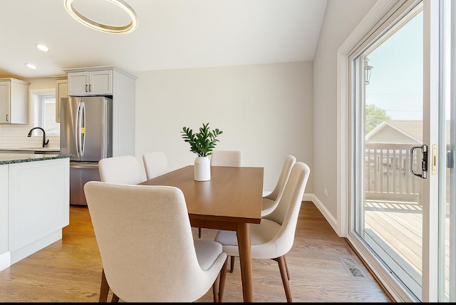 1544 N Wolf Rd, Berkeley, IL 60163 - dining space featuring healthy amount of natural light, light wood-style floors, and recessed lighting