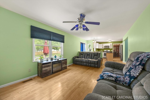 3100 Compton Rd, Aurora, IL 60504 - living area featuring a ceiling fan and light wood-style floors