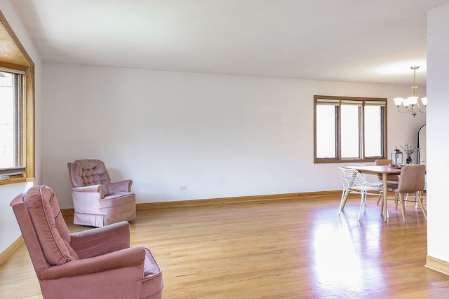 5135 W 113th Pl, Alsip, IL 60803 - living area with a chandelier and light wood-style flooring