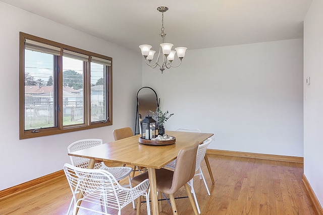 5135 W 113th Pl, Alsip, IL 60803 - dining space featuring a chandelier and light wood-style floors