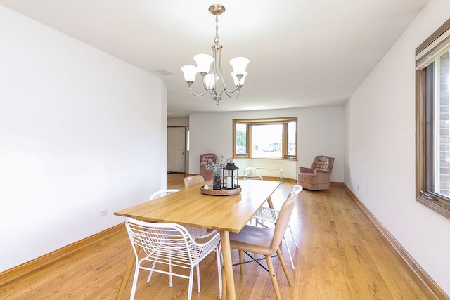 5135 W 113th Pl, Alsip, IL 60803 - dining room featuring a chandelier and light wood-style floors
