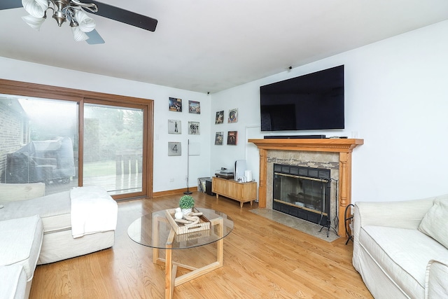 5135 W 113th Pl, Alsip, IL 60803 - living area featuring a fireplace with flush hearth, ceiling fan, and light wood-style flooring