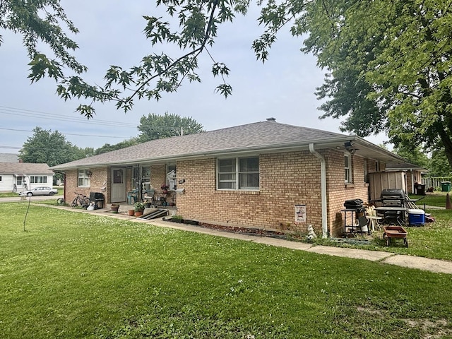 1027 Strawberry Ln, Belvidere, IL 61008 - rear view of property with a lawn and brick siding