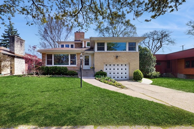 1712 Dobson St, Evanston, IL 60202 - tri-level home with a garage, driveway, a chimney, and a front lawn
