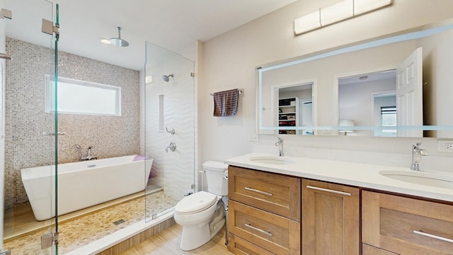 1712 Dobson St, Evanston, IL 60202 - full bath featuring a stall shower, a soaking tub, double vanity, and wood finished floors