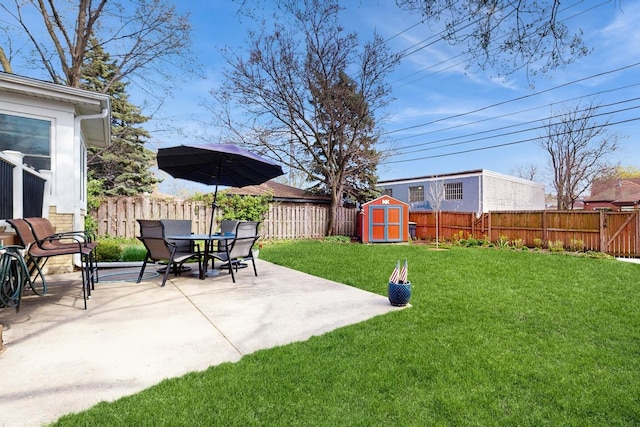 1712 Dobson St, Evanston, IL 60202 - fenced backyard featuring a storage unit and a patio area