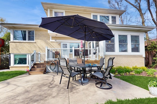 1712 Dobson St, Evanston, IL 60202 - view of patio featuring outdoor dining space and a wooden deck