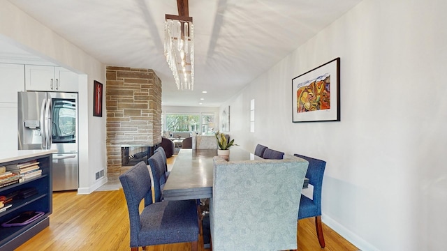 1712 Dobson St, Evanston, IL 60202 - dining space featuring light wood-style flooring and baseboards
