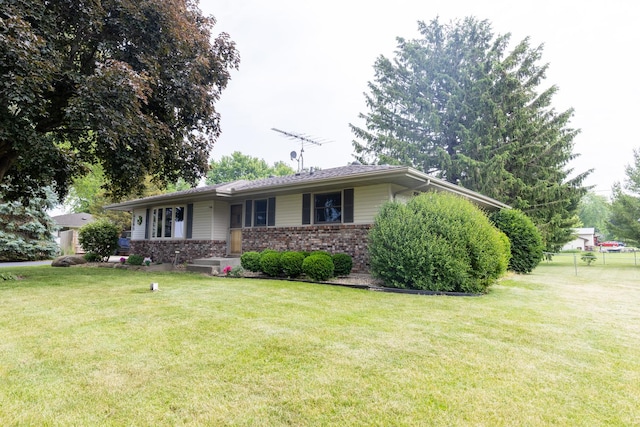 4265 Town Hall Rd, Belvidere, IL 61008 - ranch-style home featuring a front lawn and brick siding