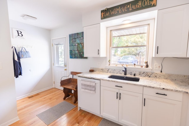4265 Town Hall Rd, Belvidere, IL 61008 - kitchen with dishwasher, light wood-type flooring, white cabinets, and healthy amount of natural light