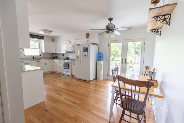 4265 Town Hall Rd, Belvidere, IL 61008 - kitchen featuring white appliances, french doors, light wood finished floors, white cabinets, and ceiling fan