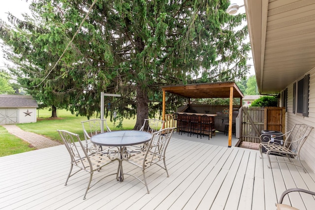 4265 Town Hall Rd, Belvidere, IL 61008 - wooden deck with a yard, an outdoor structure, and outdoor dining space