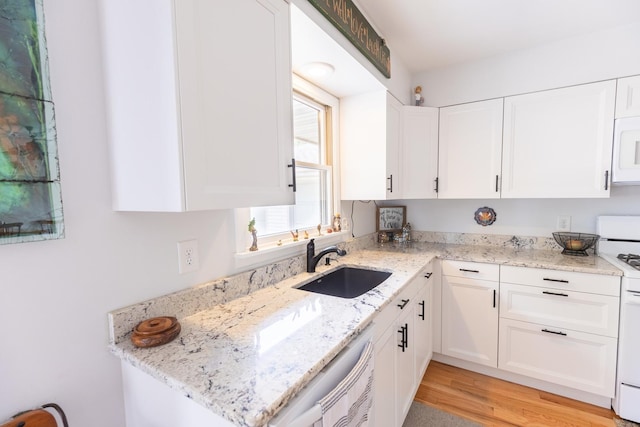 4265 Town Hall Rd, Belvidere, IL 61008 - kitchen with light stone countertops, white cabinets, white appliances, and light wood finished floors