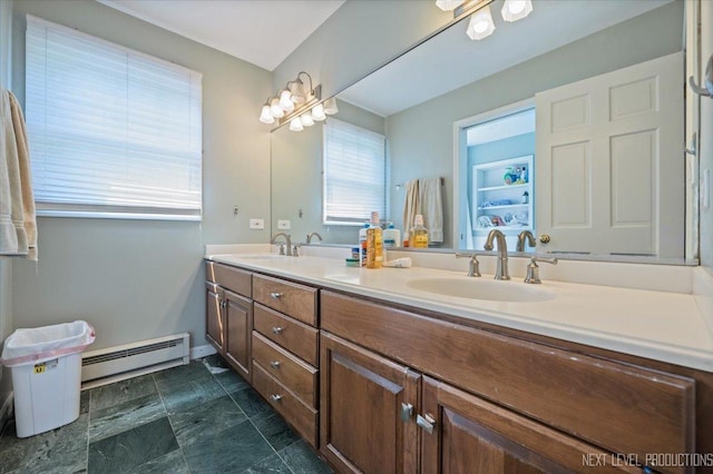 932 S Batavia Ave, Geneva, IL 60134 - bathroom featuring baseboard heating, double vanity, and stone finish flooring
