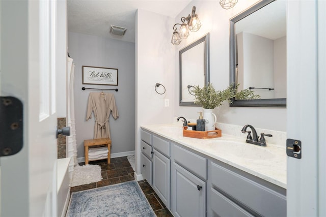 1098 Ironwood Cc Dr, Normal, IL 61761 - bathroom with stone tile floors, double vanity, a shower with shower curtain, and a bathtub