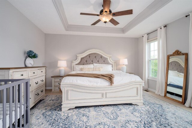 1098 Ironwood Cc Dr, Normal, IL 61761 - bedroom with a raised ceiling, ornamental molding, light carpet, and ceiling fan