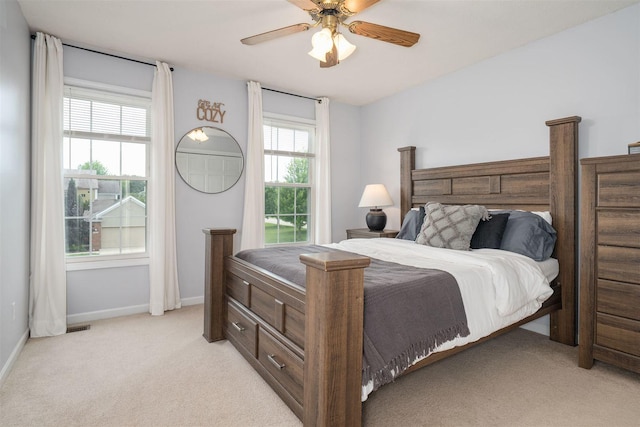 1098 Ironwood Cc Dr, Normal, IL 61761 - bedroom with light colored carpet and ceiling fan