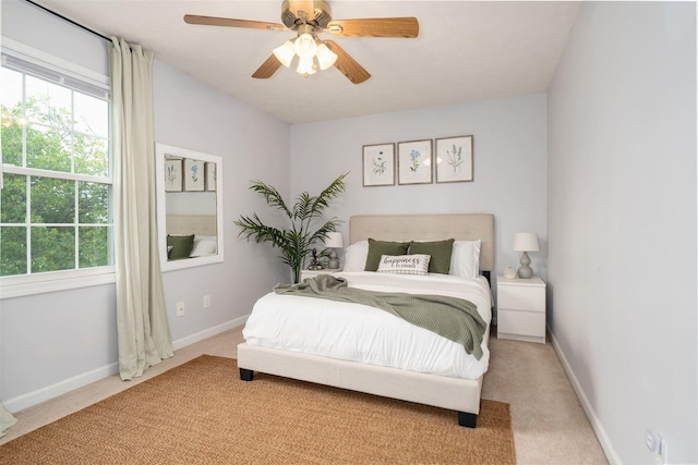 1098 Ironwood Cc Dr, Normal, IL 61761 - bedroom featuring light carpet, multiple windows, and ceiling fan