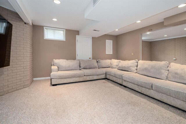 1098 Ironwood Cc Dr, Normal, IL 61761 - living area featuring brick wall, carpet floors, and recessed lighting