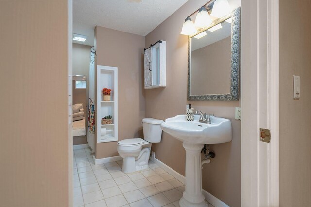 1098 Ironwood Cc Dr, Normal, IL 61761 - bathroom featuring toilet and tile patterned flooring