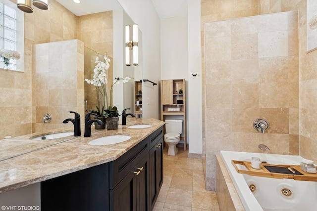 1051 N Hermitage Ave Unit 3, Chicago, IL 60622 - bathroom with a tub with jets, double vanity, tile walls, and tile patterned flooring
