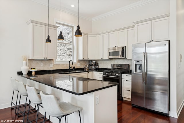1051 N Hermitage Ave Unit 3, Chicago, IL 60622 - kitchen with appliances with stainless steel finishes, a peninsula, dark wood-style floors, backsplash, and pendant lighting