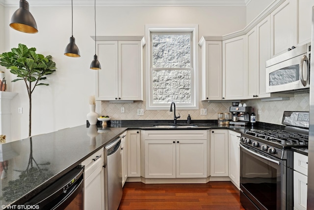 1051 N Hermitage Ave Unit 3, Chicago, IL 60622 - kitchen with appliances with stainless steel finishes, crown molding, dark wood-style floors, backsplash, and plenty of natural light