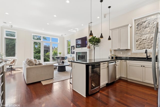 1051 N Hermitage Ave Unit 3, Chicago, IL 60622 - kitchen featuring open floor plan, beverage cooler, dark wood-style floors, crown molding, and dark countertops
