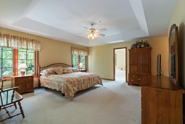 1771 Andrew Ct, Long Grove, IL 60047 - bedroom with a tray ceiling, light carpet, and a ceiling fan