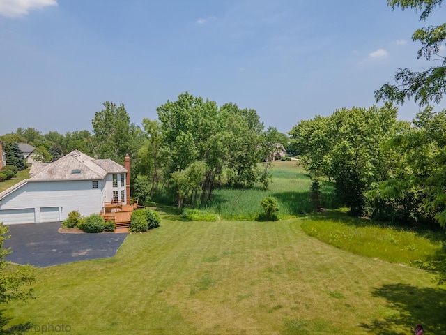1771 Andrew Ct, Long Grove, IL 60047 - view of green lawn featuring a deck and a garage