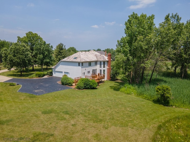 1771 Andrew Ct, Long Grove, IL 60047 - rear view of house with a lawn, a wooden deck, and a chimney