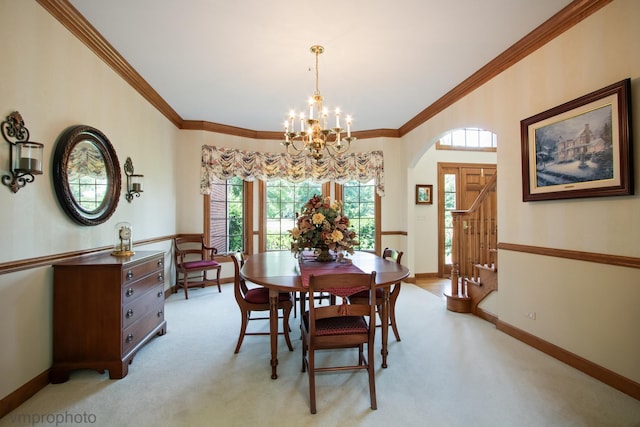 1771 Andrew Ct, Long Grove, IL 60047 - dining space featuring a chandelier, ornamental molding, light colored carpet, arched walkways, and stairs