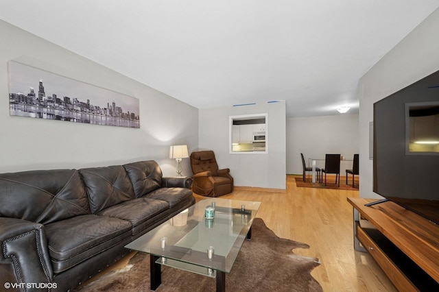 2333 N Neva Ave Unit 114C, Chicago, IL 60707 - living room featuring light wood finished floors
