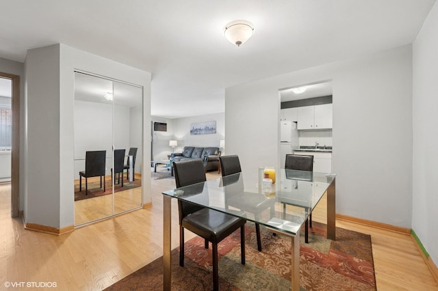 2333 N Neva Ave Unit 114C, Chicago, IL 60707 - dining space with light wood finished floors and baseboards