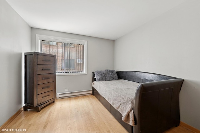 2333 N Neva Ave Unit 114C, Chicago, IL 60707 - bedroom with a baseboard radiator and light wood finished floors