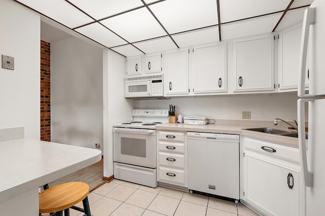 1420 Woodbridge Rd Unit 3C, Joliet, IL 60436 - kitchen featuring white appliances, light tile patterned floors, light countertops, and white cabinets