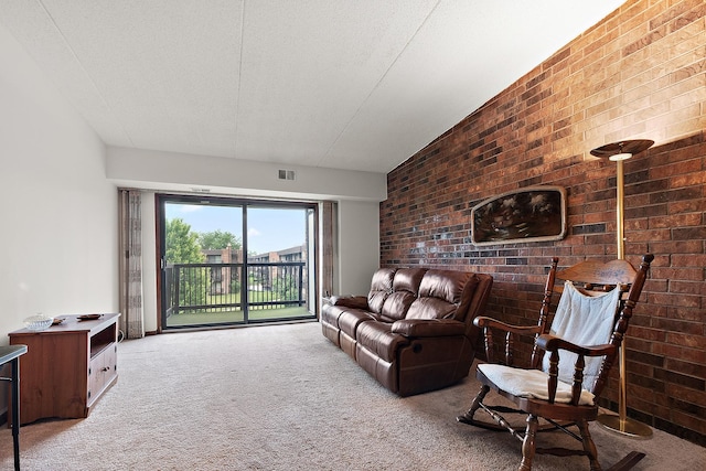 1420 Woodbridge Rd Unit 3C, Joliet, IL 60436 - carpeted living room with brick wall