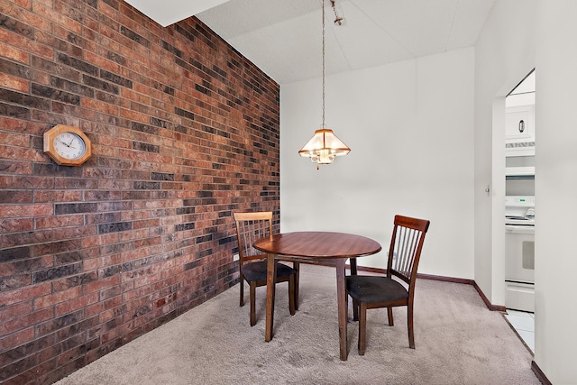 1420 Woodbridge Rd Unit 3C, Joliet, IL 60436 - dining room featuring brick wall, light colored carpet, and a chandelier