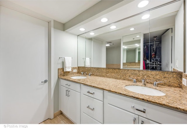 950 N Michigan Ave Unit 2901, Chicago, IL 60611 - bathroom with double vanity, recessed lighting, a spacious closet, and tile patterned flooring