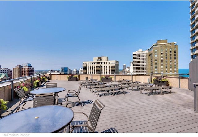 950 N Michigan Ave Unit 2901, Chicago, IL 60611 - wooden terrace with a city view and outdoor dining area