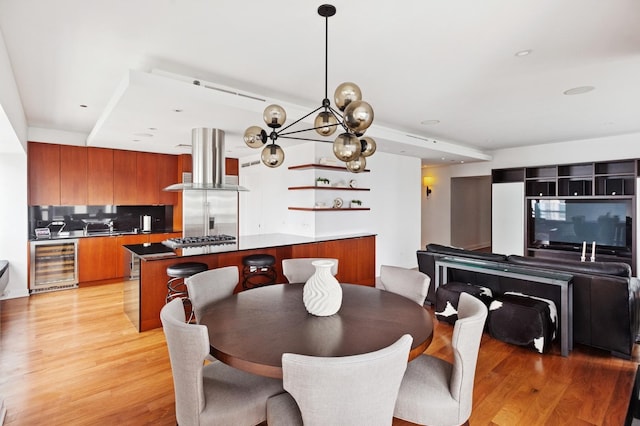 800 N Michigan Ave Unit 3103, Chicago, IL 60611 - dining room featuring beverage cooler, light wood finished floors, recessed lighting, and a chandelier