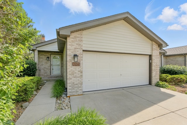 10935 Barbs Way, Orland Park, IL 60467 - mid-century home featuring brick siding, a garage, a chimney, and concrete driveway