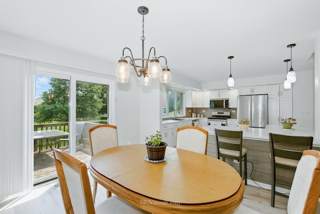 10935 Barbs Way, Orland Park, IL 60467 - dining space with a chandelier and light wood finished floors