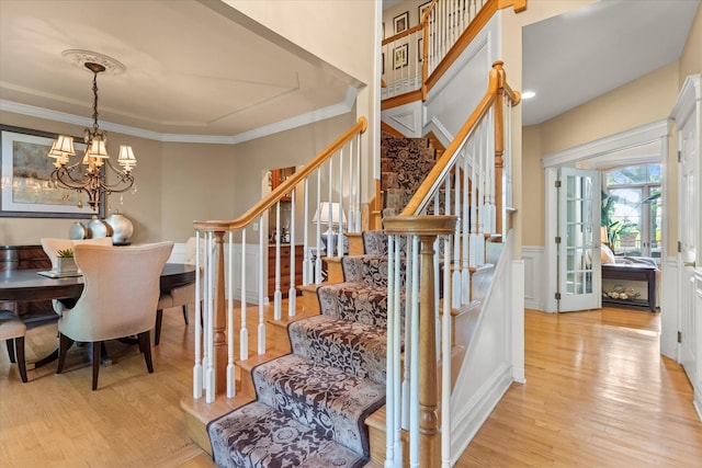 1396 Notre Dame Dr, Lemont, IL 60439 - stairway featuring a chandelier, wood finished floors, ornamental molding, and wainscoting
